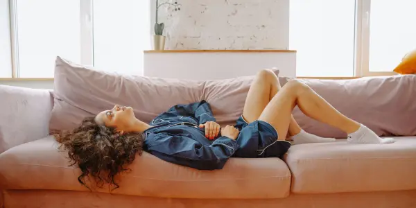 A woman experiencing discomfort from gut problems and digestive health issues